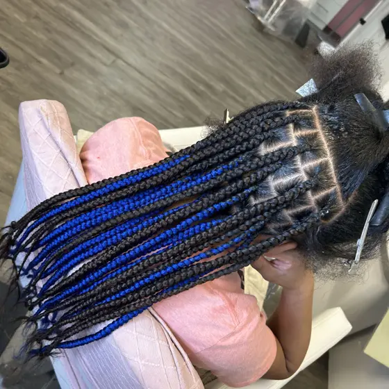 Medium knotless mid back braided by Tiffany Joy