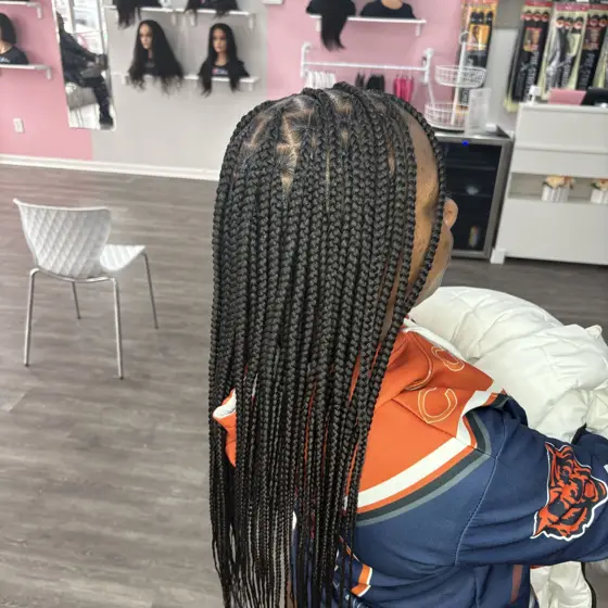 Medium knotless mid back braided by Tiffany Joy