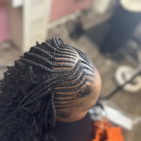 Over 9 stitch braids with sew in braided by Tiffany Joy